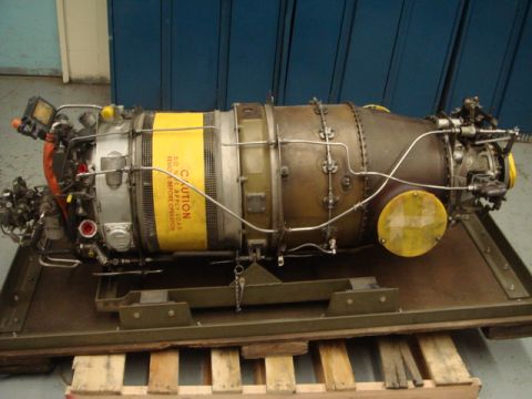 1996 Ford Bronco - A jet engine is shown mounted on a pallet, with a prominent yellow caution label.