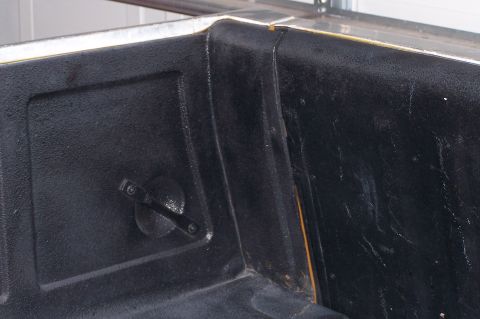 1973 Ford Ranchero - Close-up of a black textured truck bed with a metal tie-down anchor visible.