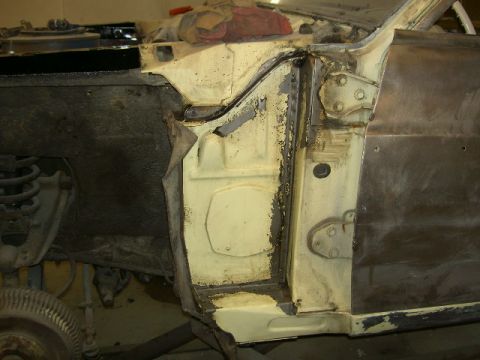 1967 Ford Ranchero - Close-up of the door frame and fender area of a 1967 Ford Ranchero undergoing restoration.
