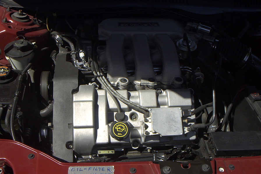 Transverse Ford Taurus V6 engine bay with intake manifold visible