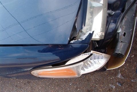 1999 Ford Crown Victoria - This fender is bent here, and pushed back against the passenger door. It also carried the hood back on this side, making it turn & overlap…