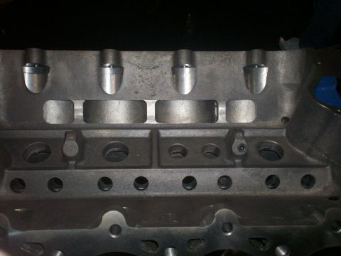1990 Ford Mustang - Close-up view of an engine block, showing internal components and bolt holes. The registry claims it's a 1990 Ford Mustang, but this is unc…