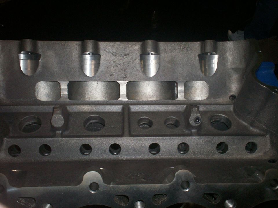 Engine block detail with valve guides and bolt holes