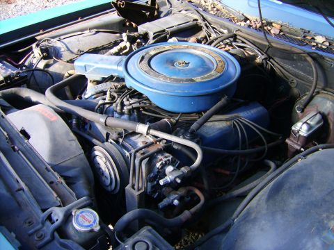 1971 Mercury Marquis - Close-up view of the engine compartment, showing the air cleaner, hoses, and engine block.
