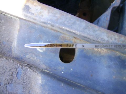1971 Mercury Marquis - Oil dipstick reads between ADD and SAFE, indicating the oil level is correct.