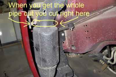 1999 Ford Taurus - Close-up view of a vehicle's air intake system with instructional markings.