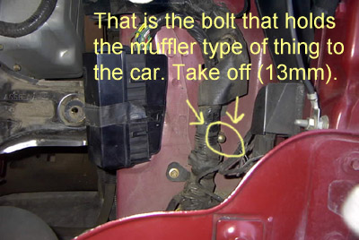 1999 Ford Taurus - This image shows a bolt used to attach an exhaust component to a vehicle.