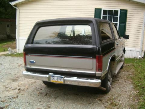 1986 Ford Bronco - This 1986 Ford Bronco is seen from the rear, a two-tone paint scheme of black and silver.