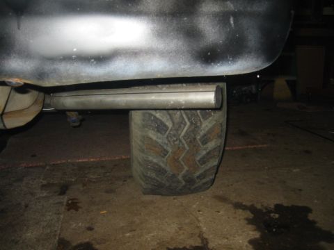 1986 Ford Bronco - Exhaust pipe and tire are visible in this close-up shot.
