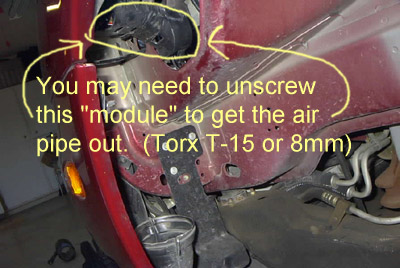 1999 Ford Taurus - This image shows a close-up of a vehicle's internal components, with instructions for removal.