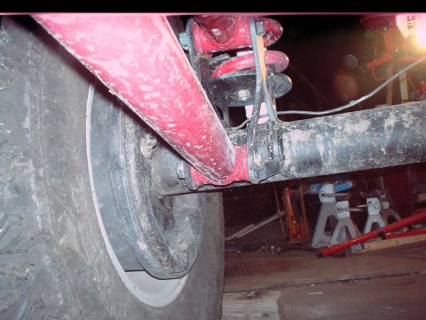 1984 Ford Bronco - Rear axle and suspension parts of a vehicle, possibly undergoing maintenance or repair.