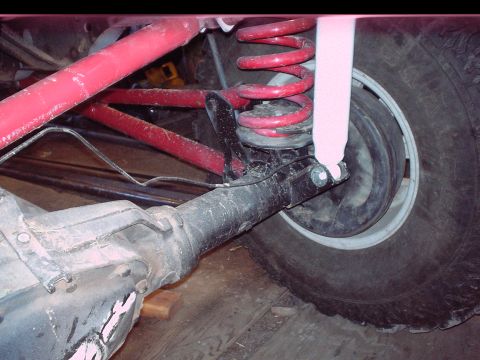 1984 Ford Bronco - Close-up view of the rear axle and suspension system on a 1984 Ford Bronco.