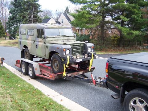 1974 Land Rover Land Rover - Camouflaged 1974 Land Rover Land Rover loaded onto a trailer for transport.