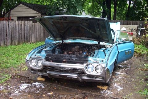 1978 Ford Bronco - A blue 1958 Ford Thunderbird convertible sits with its hood and driver's door open in a yard.