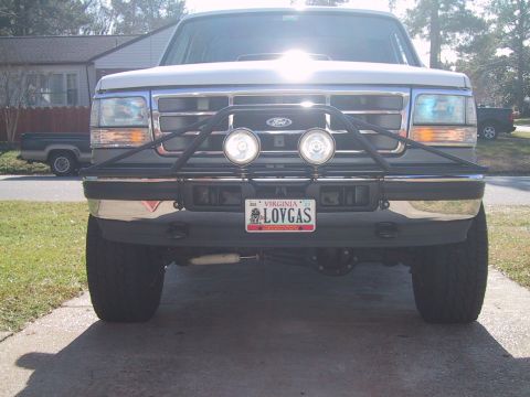 1994 Ford Bronco - Front view of a 1994 Ford Bronco, a custom bumper with auxiliary lights and a Virginia license plate.