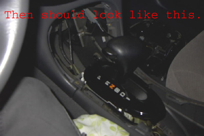 1999 Ford Taurus - The interior center console shows a floor shifter with gear indicators P R N D.