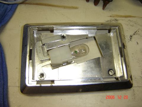 1993 Ford Bronco - Close-up of an interior light fixture, showing the bulb socket and mounting mechanism.