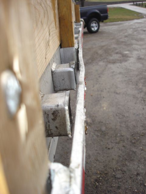 2006 Ford F-350 - Side view of a 2006 Ford F-350 truck bed rail, showing construction details.