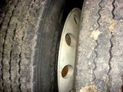 2006 Ford F-350 - Close-up view of the dual rear tires and hubcap on a 2006 Ford F-350.