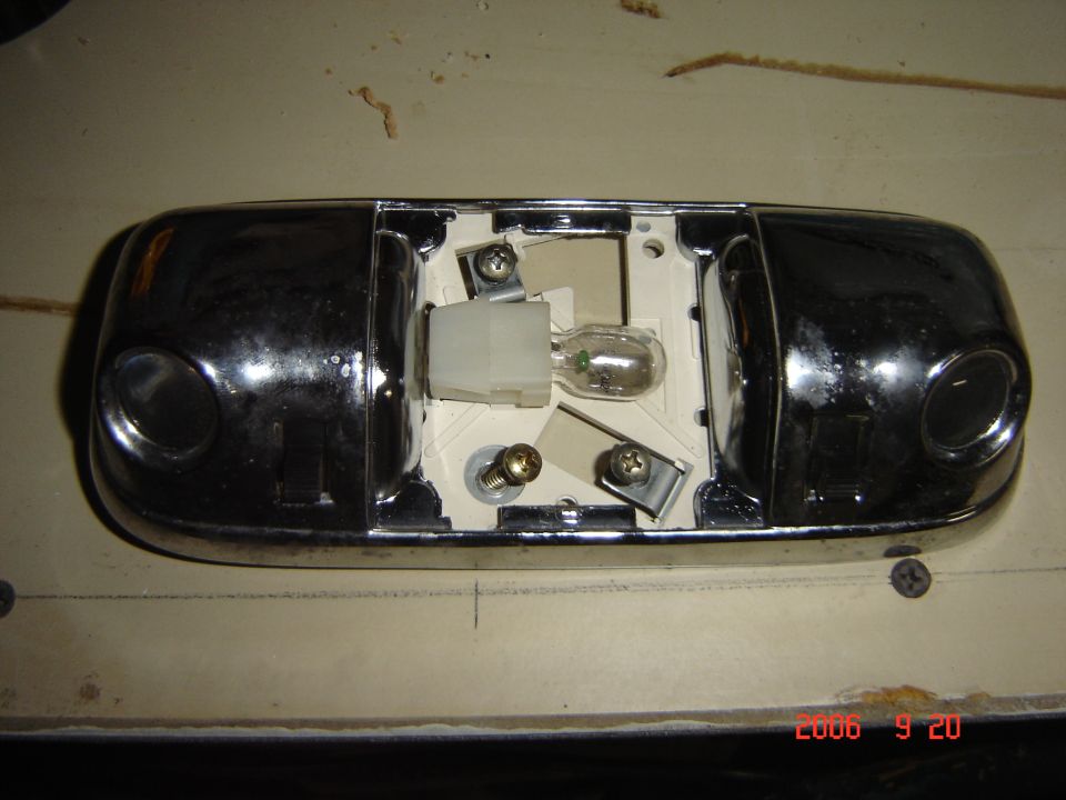 Interior dome light assembly with chrome housing and exposed bulb