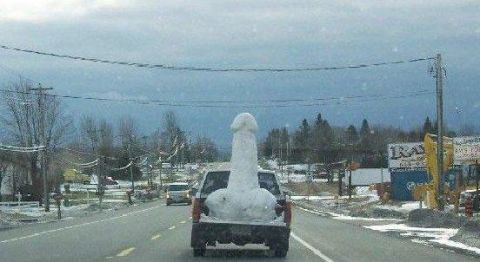 1971 Ford Ranchero - A pickup truck transports a large snow sculpture on a winter day.