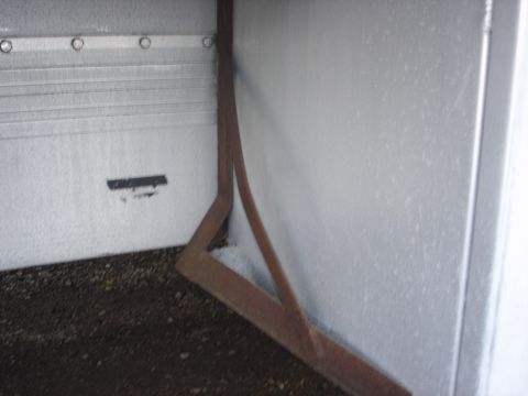 2006 Ford F-350 - Interior view of a trailer with metal walls and a metal support structure.
