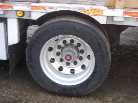 2006 Ford F-350 - A close-up view of a heavy-duty truck's wheel and fender assembly.