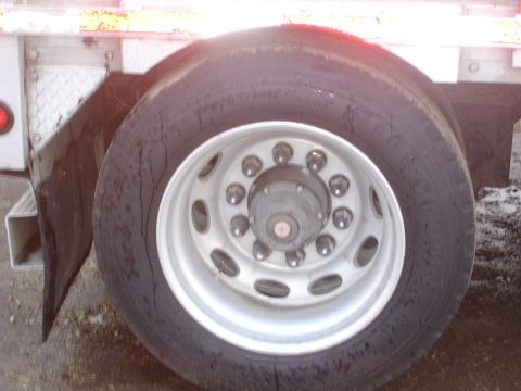 2006 Ford F-350 - Close-up of a truck's rear wheel and fender assembly.