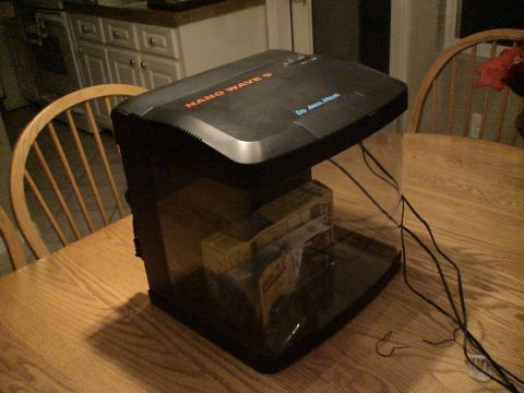 1993 Ford C-350 (Centurion Conversions) - An AquaMedic NanoWave9 aquarium is shown on a table, with some boxes inside.