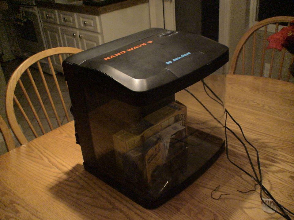 Black Nano Wave 9 appliance on a wooden kitchen table