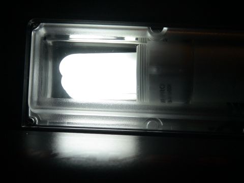 1993 Ford C-350 (Centurion Conversions) - Close-up of a fluorescent light fixture, showing the bulb and casing.