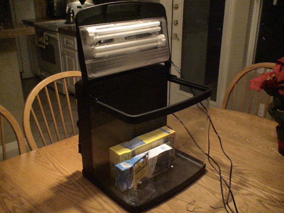 Black light/magnifier device with fluorescent tubes on a wooden table indoors