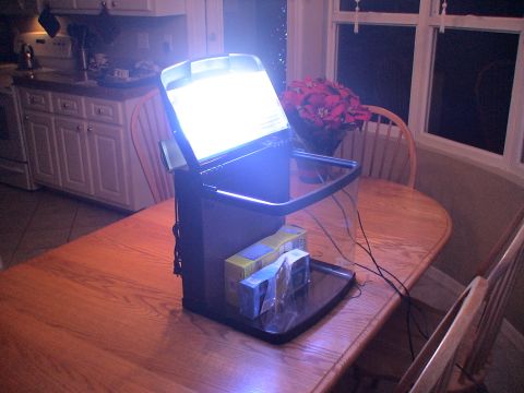 1993 Ford C-350 (Centurion Conversions) - A lit aquarium sits on a wooden table in a kitchen area, with poinsettias in the background.