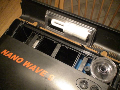 1993 Ford C-350 (Centurion Conversions) - The AquaMedic NanoWave9 filter is shown with its lid open, revealing the fluorescent bulb and internal filtration components.