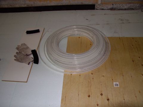 1986 Ford Bronco - Here's the 300 foot coil of PEX tubing. Kept it warm in the house and warmed up the garage with the heater so it would un-coil more easily.