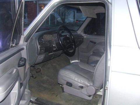 1992 Ford Bronco - Interior view of a 1992 Ford Bronco, highlighting its gray leather seats and dashboard.