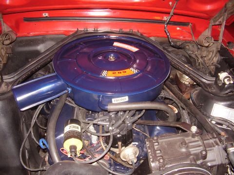 1996 Ford F-150 - Close-up of an engine bay, focusing on the air cleaner and ignition components.