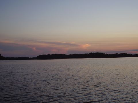 1996 Ford F-150 - A lake scene at dusk with a colorful sky and silhouetted trees.