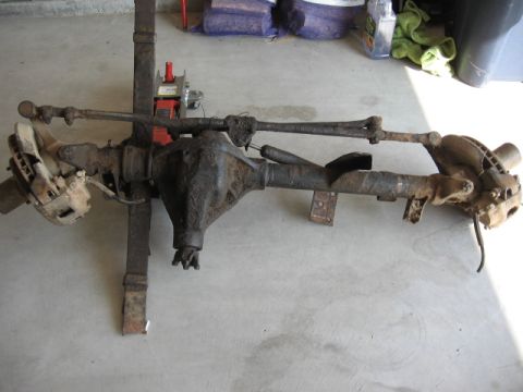 1986 Ford Bronco - Front axle assembly, likely from a truck or SUV, shown disassembled.