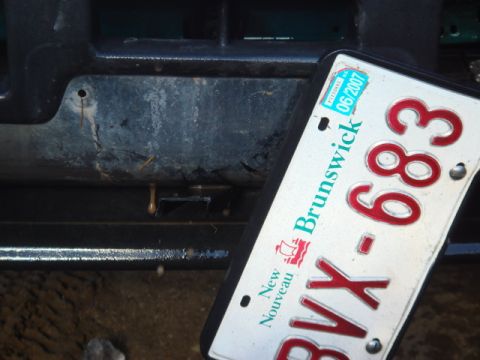 1996 Ford Bronco - Close-up of a New Brunswick license plate in front of a vehicle's bumper and grille.