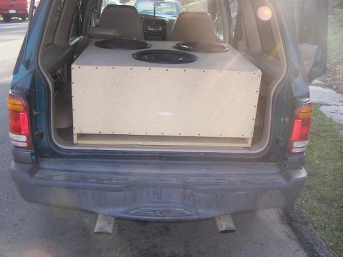1998 Mercury Mountaineer - The rear cargo area of a 1998 Mercury Mountaineer is filled with a large subwoofer box.