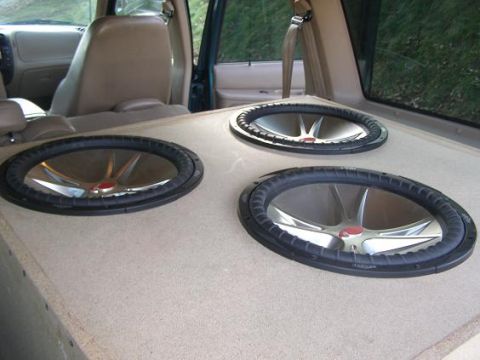 1998 Mercury Mountaineer - Custom subwoofer box installed in the cargo area of an SUV, with seats visible in the foreground.