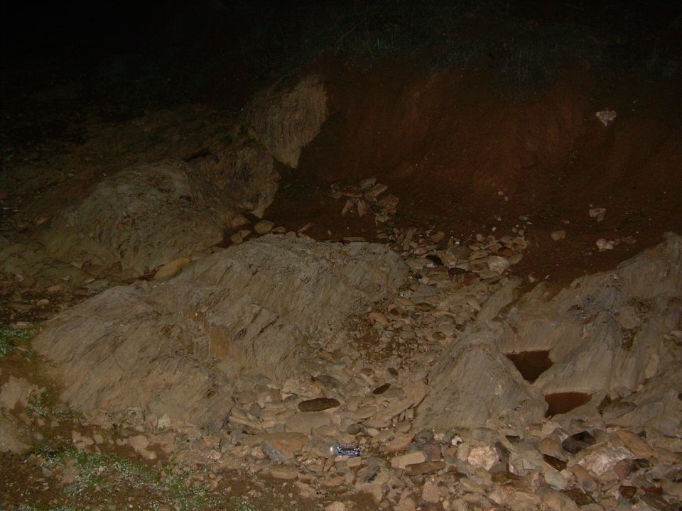 Rocky embankment and loose rocks at night