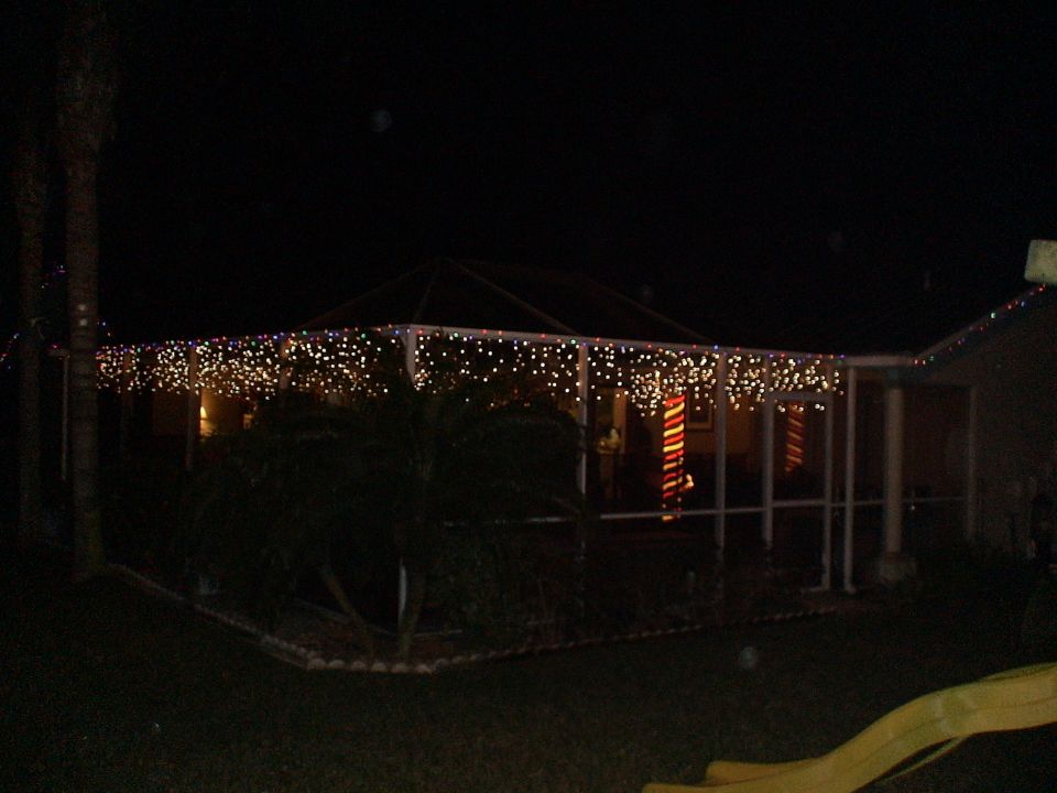 House decorated with Christmas lights at night