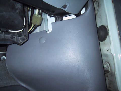 1994 Ford Bronco - Detail of interior trim and electrical components within a vehicle.