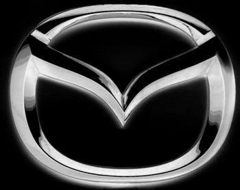 1995 Ford Probe - Close-up of a chrome Mazda emblem.