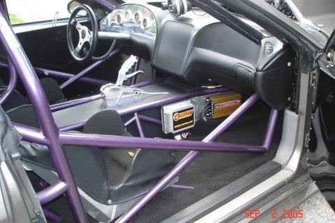 1990 Ford Mustang - Custom race car interior features a full roll cage and racing bucket seats.