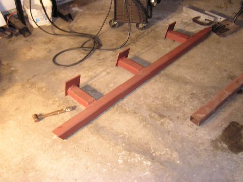 2000 Chevrolet Tahoe - Custom metal sliders and a hammer on a concrete floor.