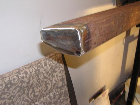 2000 Chevrolet Tahoe - A close-up view of a metal tube, possibly a part, with visible rust and a polished end.