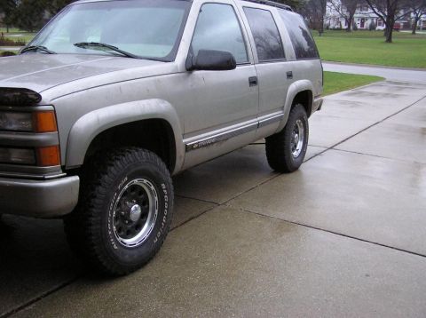 2000 Chevrolet Tahoe - This SUV is parked on a wet driveway with a suburban neighborhood in the background.